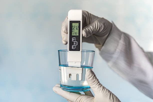 Testing San Diego tap water for hard water minerals using a digital TDS meter.